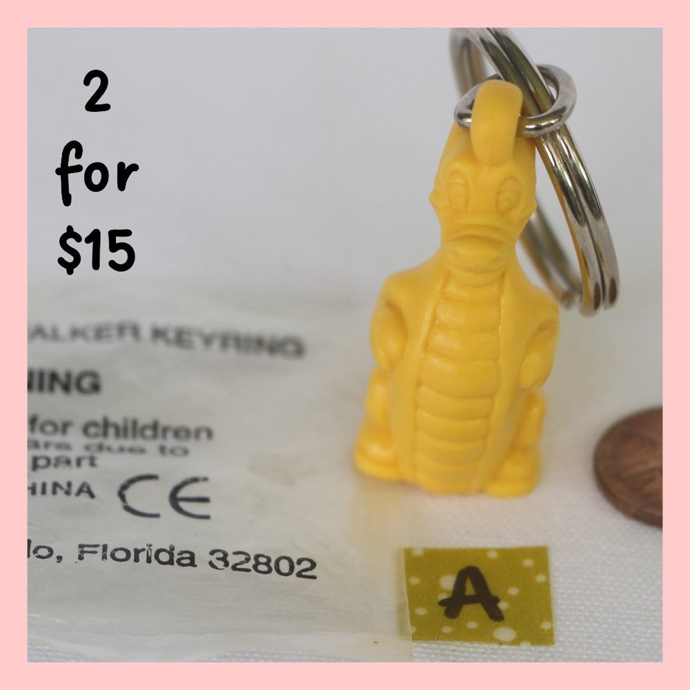 Vintage Tupperware Douglas Dirtwalker Dragon Keychain (yellow) NEW!